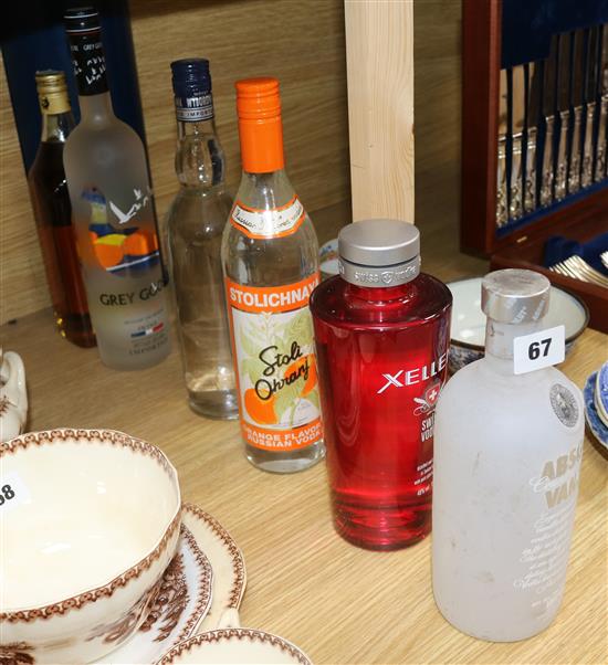 Six bottles of assorted spirits including Grey Goose and Absolut flavoured vodka and Old Krupnik Polish Honey Liqueur.
